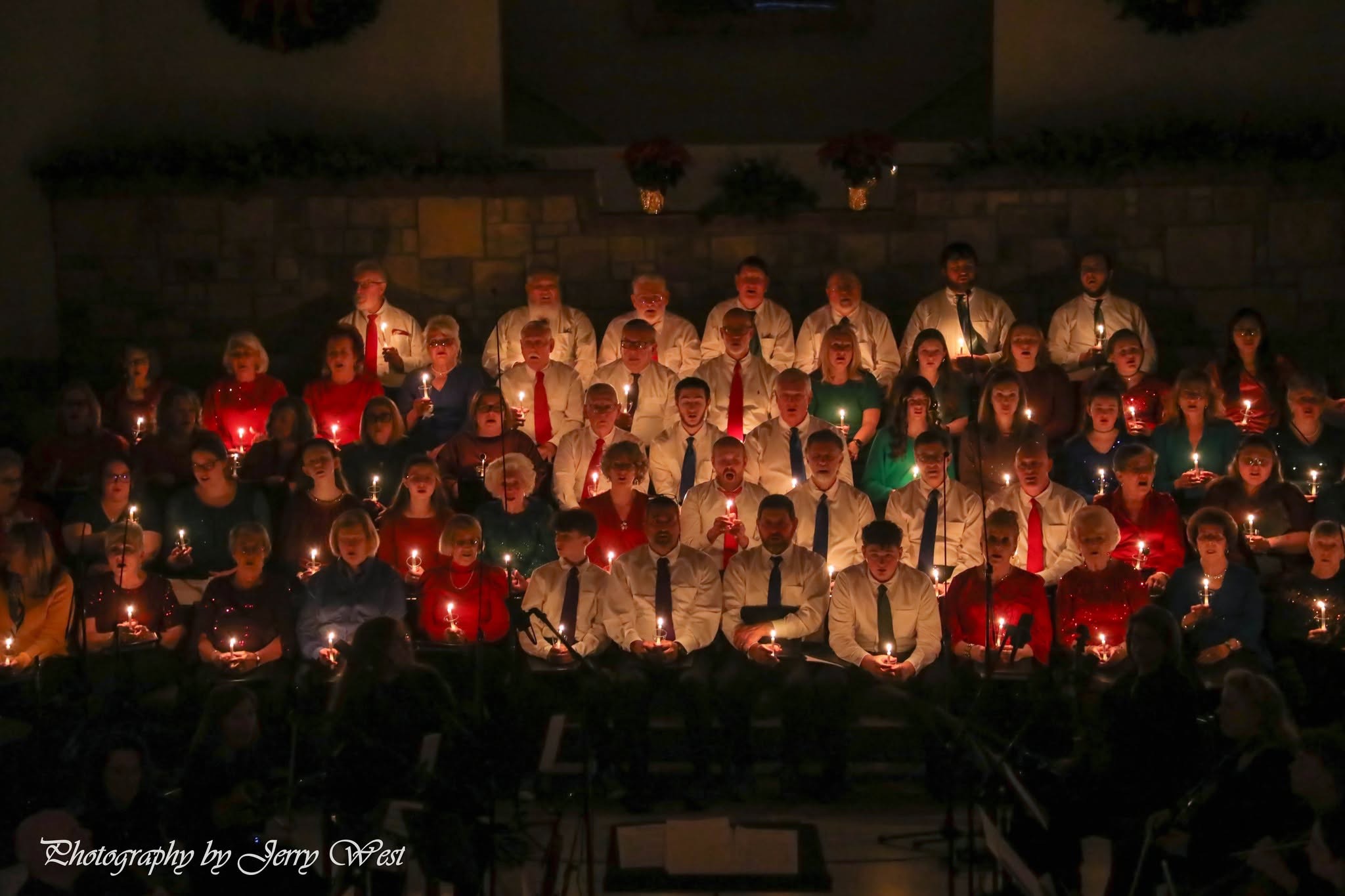 Fellowship Chapel Worship Choir singing by candlelight at last year's Christmas service